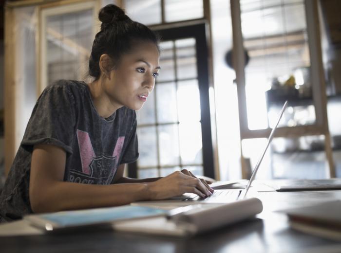 Woman studying on computer