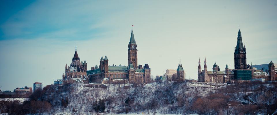 Photos of the Canadian Parliament buildings in early winter, taken from the river. 