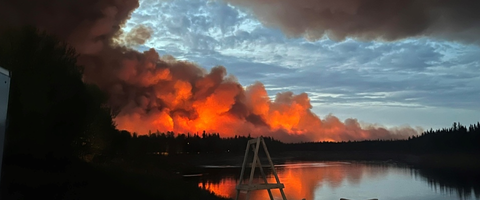 Fire and smoke from a wildfire are shown in Hay River, Northwest Territories THE CANADIAN PRESS/James Cardinal Jr.
