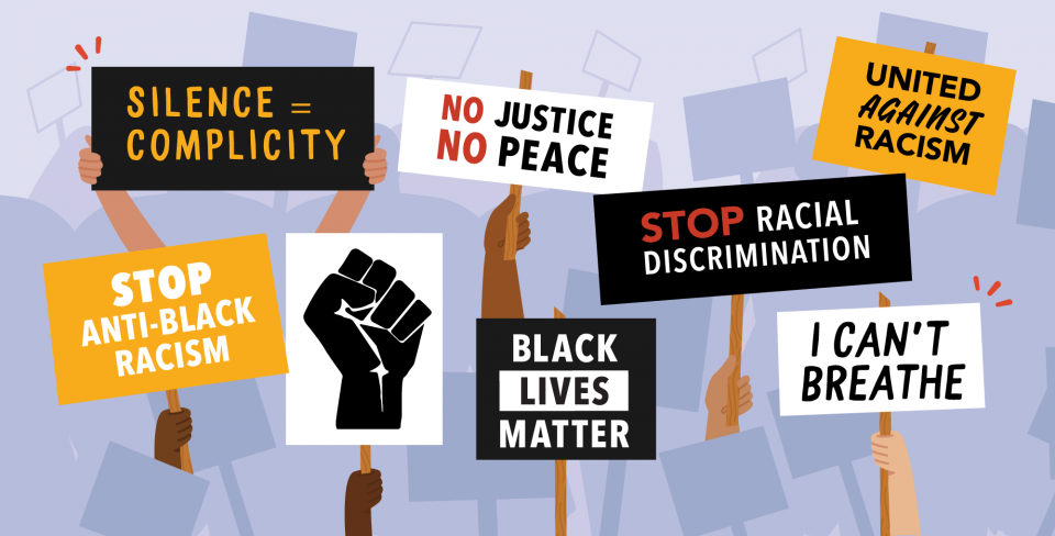 Several signs with anti-racist messaging