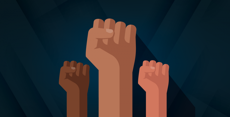 Diverse fists in the air with a blue background
