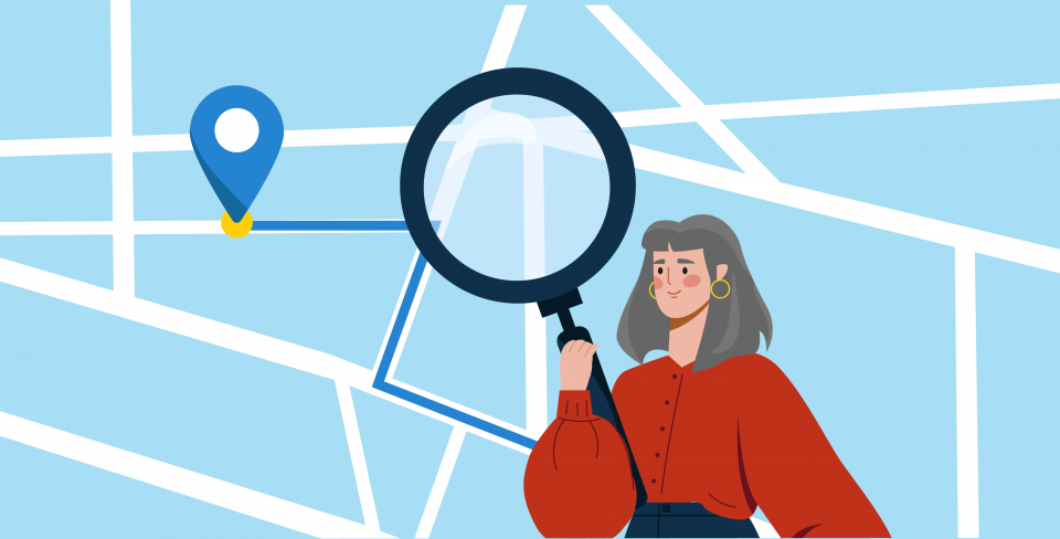 A woman looking at a map with a magnifying glass and a pin drop for a regional office