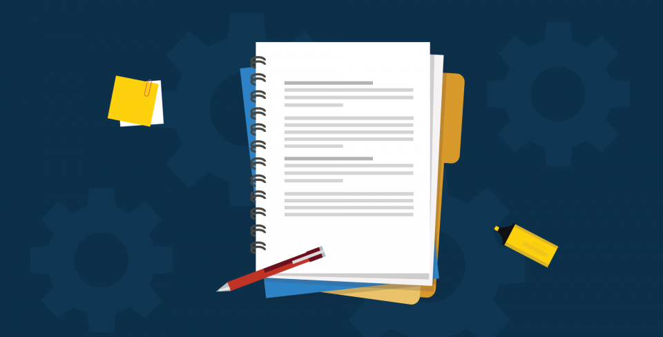 Notebook, pen, and post-its on a navy background.